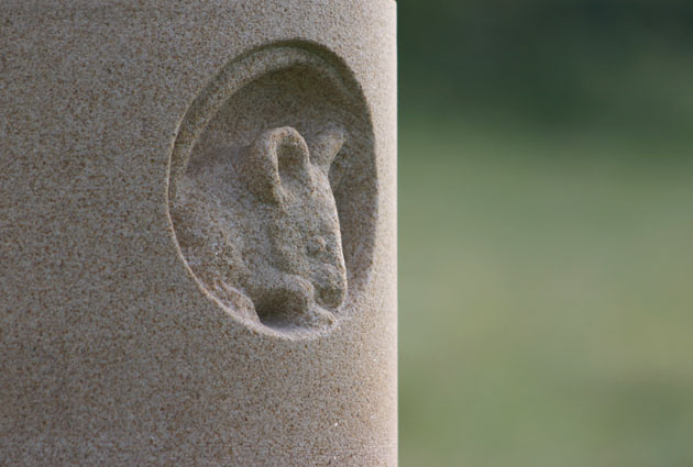 Mouse in a hole relief carved in stone