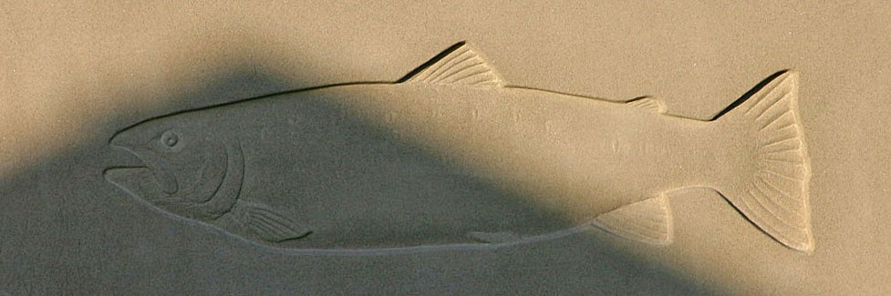 Relief carved fish in stone