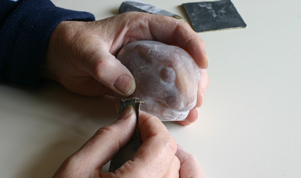 Mouse sculpture being sanded