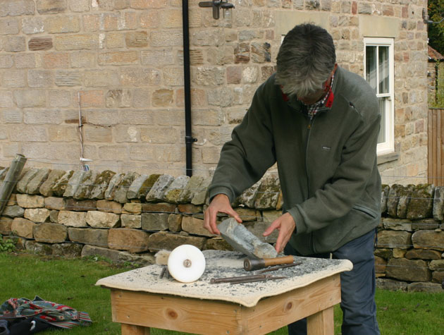 A soapstone carving begins