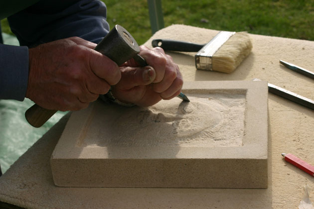 relief carved face