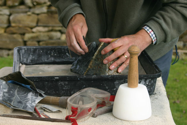 stone being rubbed down