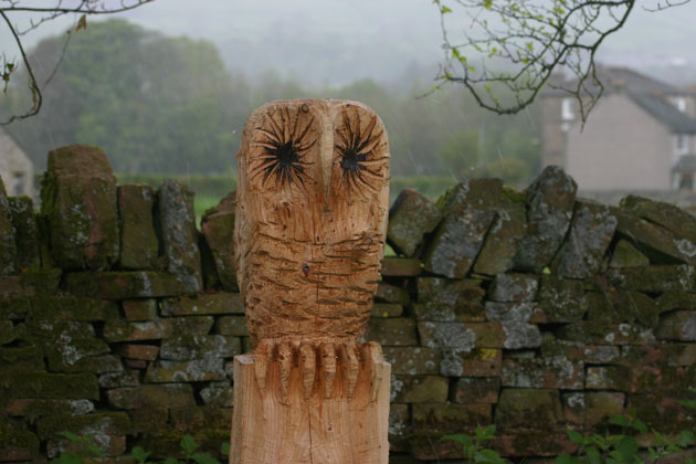 Owl sculpture carved in wood