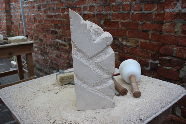 Carved stone column sculpted at Rural Arts workshop
