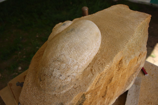 Carving a snail in stone