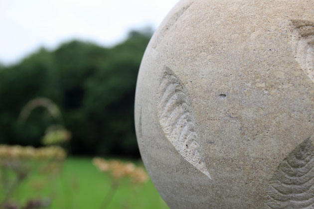 Stone ball carved with leaves