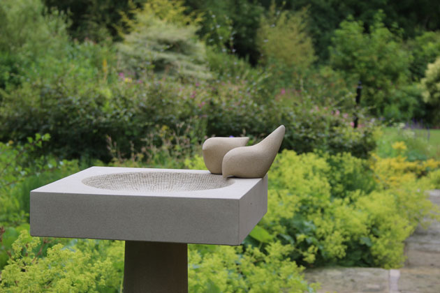 Tall and elegant stone birdbath