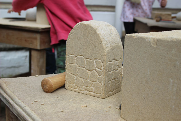 A stone wall carved in stone