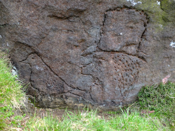 Stone carving of a bird and a man in a top hat