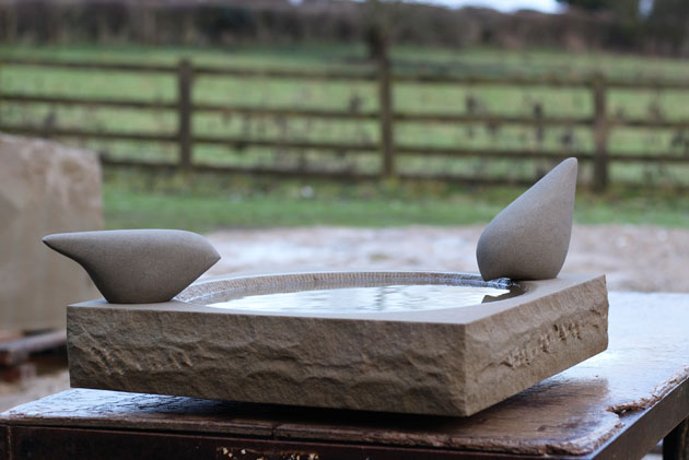 Birdbath with stone birds