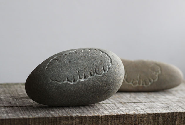Carved stone pebble