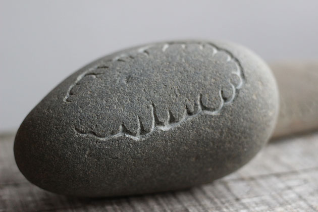 Carved stone pebble
