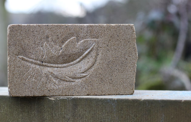 Feather carved in stone