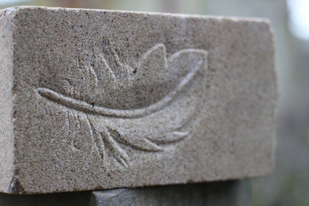 feather relief carved in stone