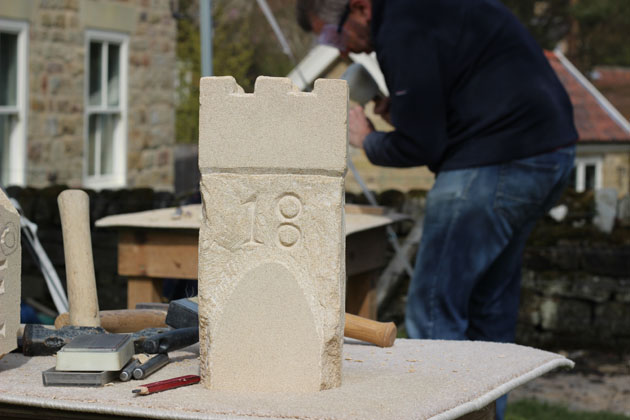 Castle carved in stone during the Spring Stone Carving Course