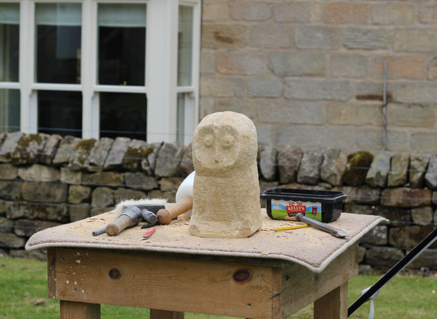 Owl waiting for his feet to be carved