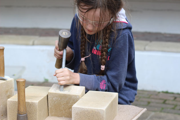 Stone carving a relief panel