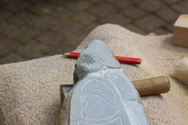 Stone carving man with beard