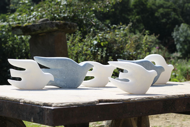 Flock of stone birds sculpture