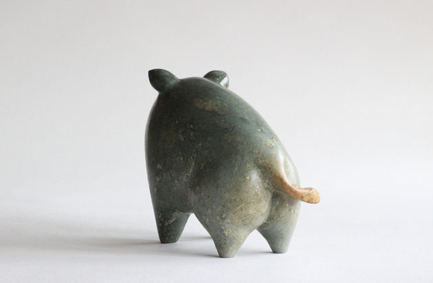 Wild Pig sculpture with tan tail
