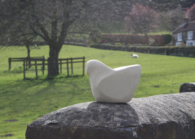 carved stone bird on a wall