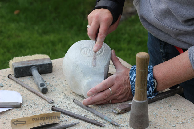 frog carving being filed