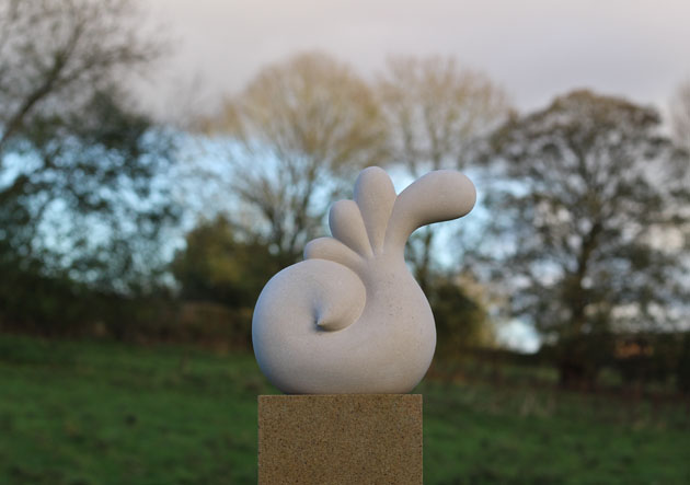 Plume sculpture carved in Portland Limestone