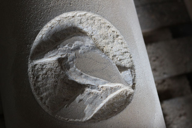 Carving a Kingfisher in stone