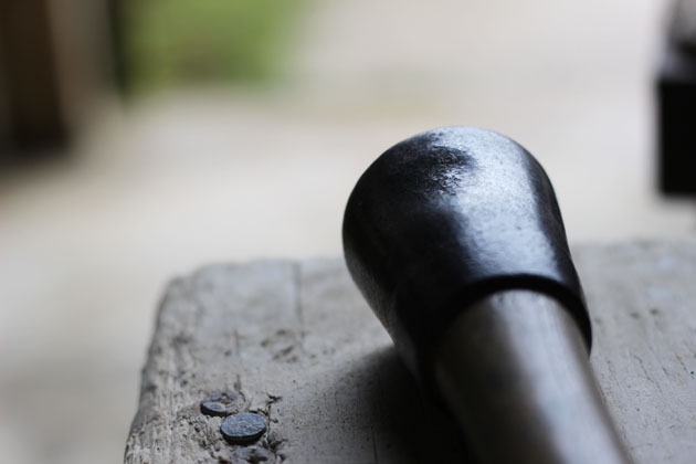 Worn stone carving mallet from many years of use