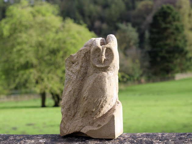 Long eared owl carved in stone