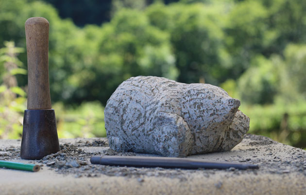 Carving a mole in soapstone