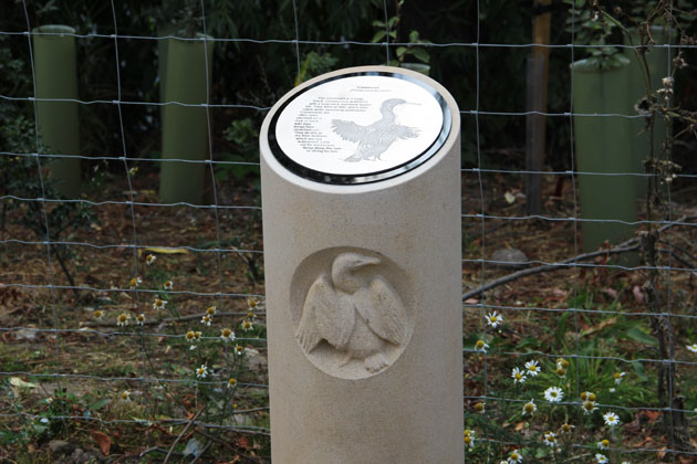 Stone carving of a cormorant