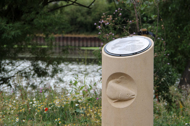 Stone carving of a salmon