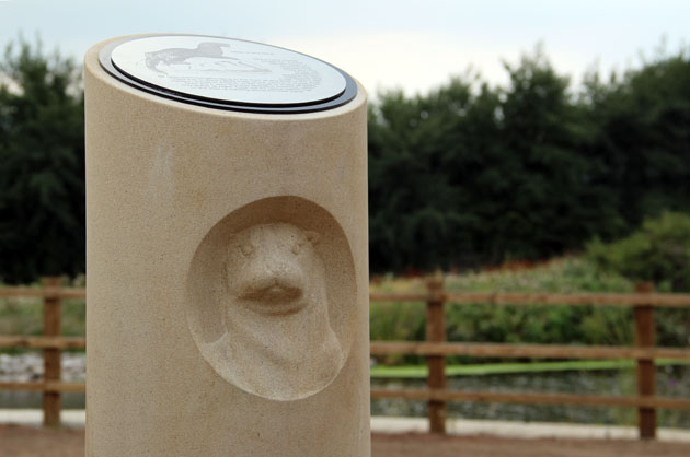 Stone carving of an otter