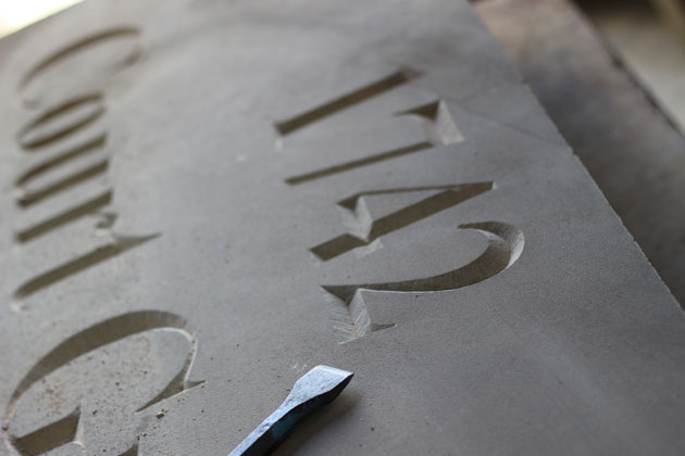 Carved stone date and house name