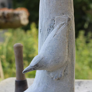 Carving a bird in stone