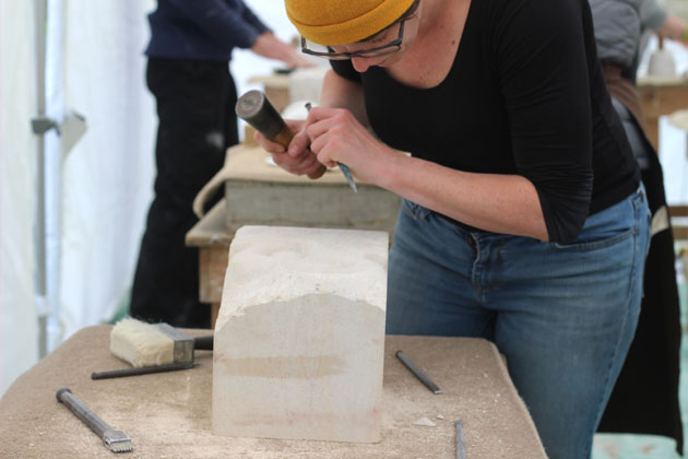 Carving a Koru in stone