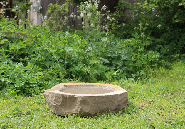 Natural stone birdbath