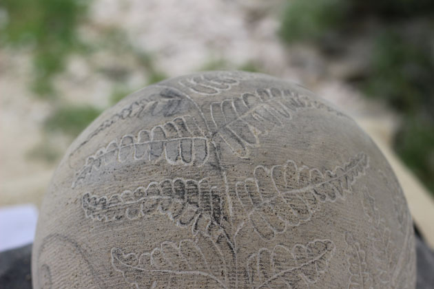 Carving fern fronds in stone