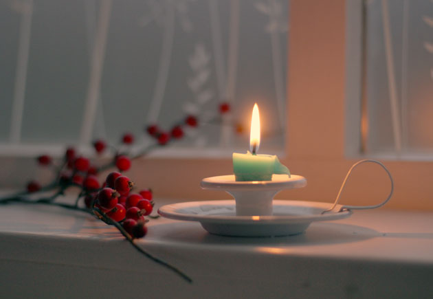 winter berries and candlelight