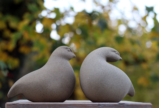 A pair of Patridges sculpture