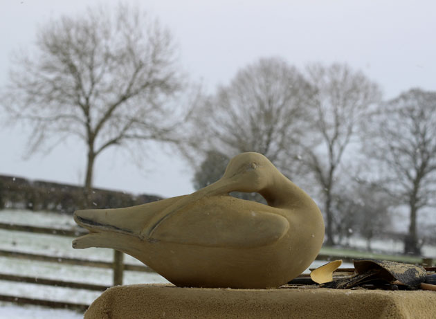 Carving a Curlew sculpture