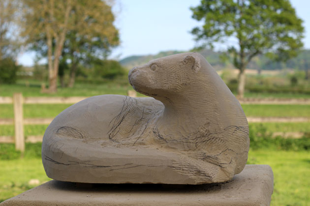 carving an otter sculpture