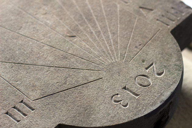 detail of the numerals carved on the sundial