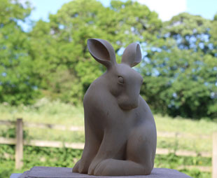 Hare grooming sculpture