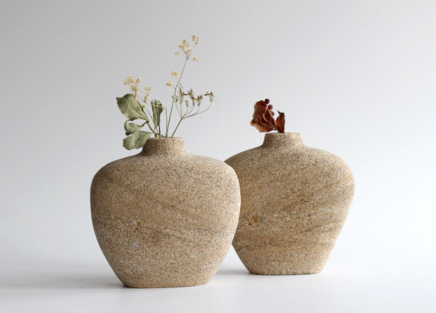 Stem vases carved in stone